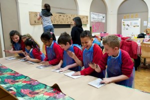 Schoolchildren enjoying printing at one of the art workshops