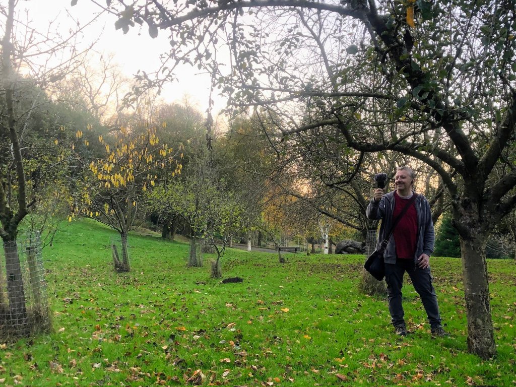 Podcaster Simon Galloway pictured in the Gorse Hall orchard recording the podcast. 